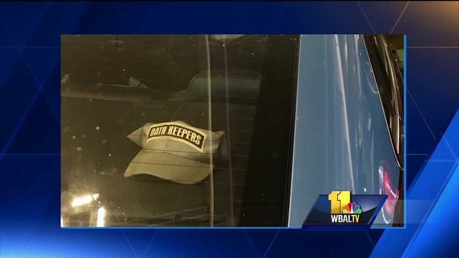An Anne Arundel County police officer has been suspended after a picture of a police cruiser with a hat inside that had the name of the controversial Oath Keepers group on it was brought to the department's attention, police said.