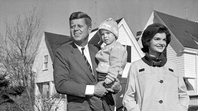 Sen. John F. Kennedy, Democrat presidential nominee, is shown with his wife, Jacqueline, as he holds their daughter, Caroline, outside their home in Hyannis Port, on Nov. 8, 1960.