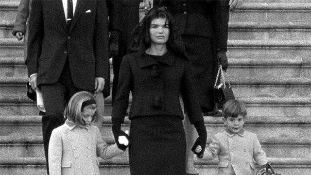 Jacqueline Kennedy walks down the Capitol steps with her daughter Caroline and son John Jr. after President John. F. Kennedy's casket was placed in the rotunda in Washington Nov. 24, 1963.