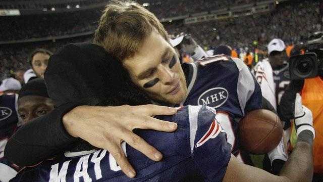 New England Patriots quarterback Tom Brady (12) hugs middle linebacker Jerod Mayo (51) after the AFC Championship game in Foxborough in 2012.