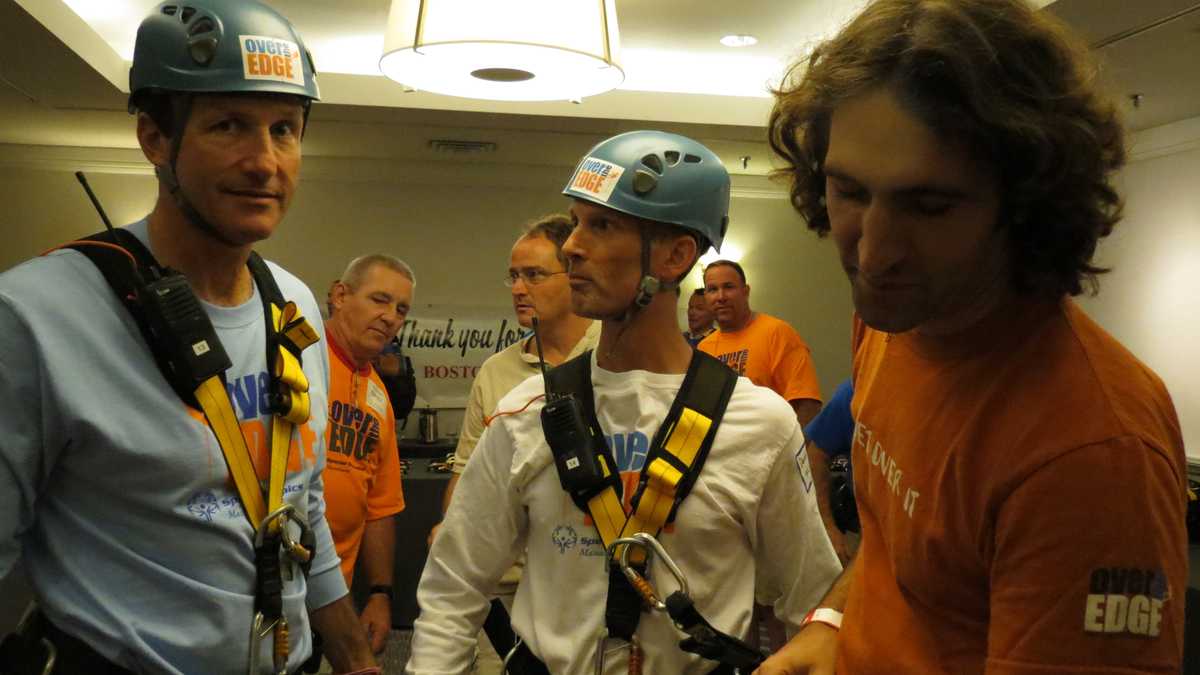 Images: Anthony and David rappel down Hub building