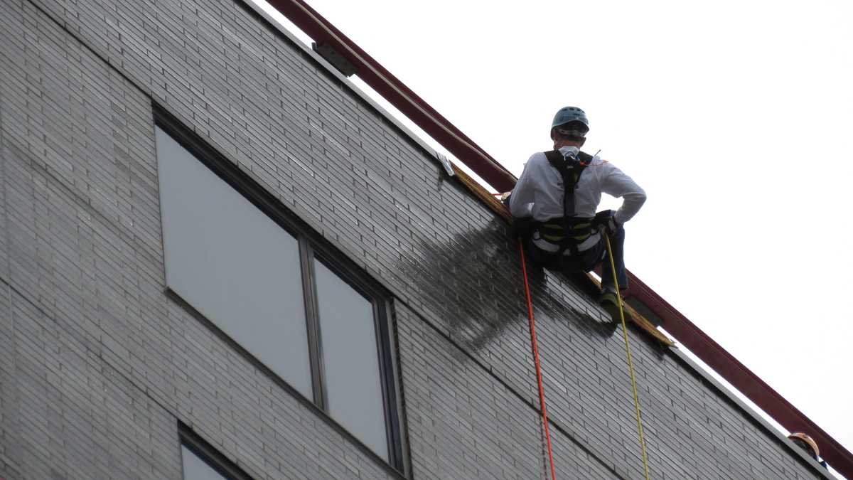 Images: Anthony and David rappel down Hub building