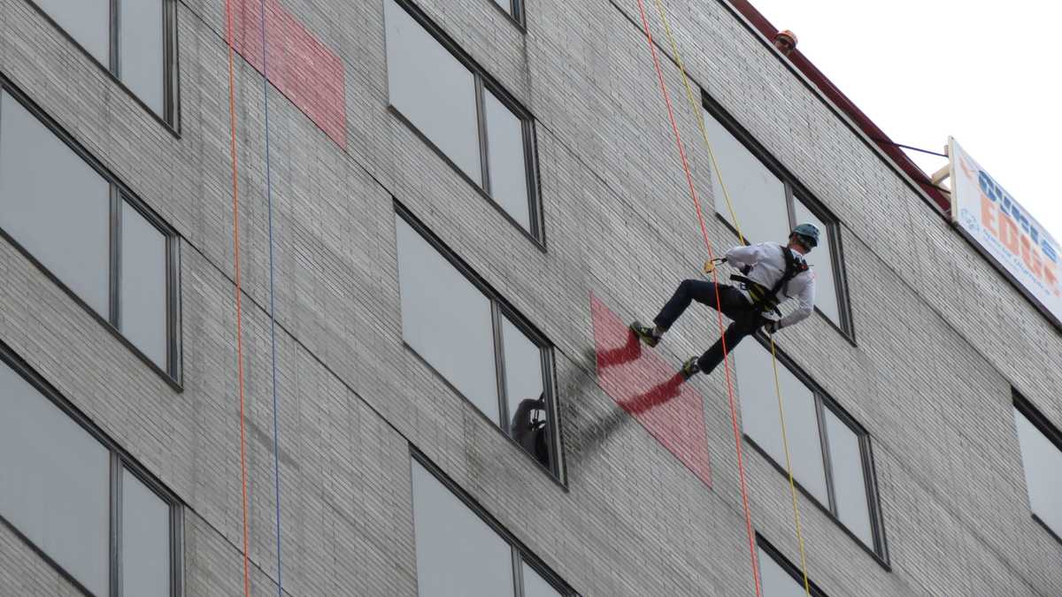 Images: Anthony and David rappel down Hub building