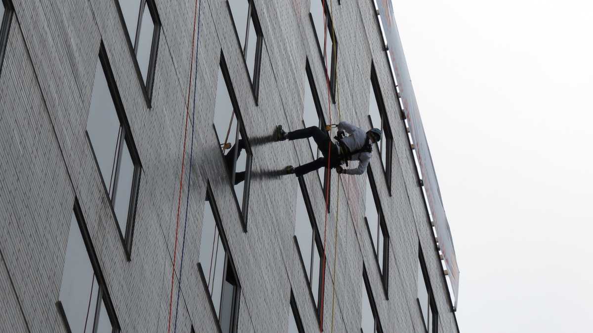 Images: Anthony and David rappel down Hub building