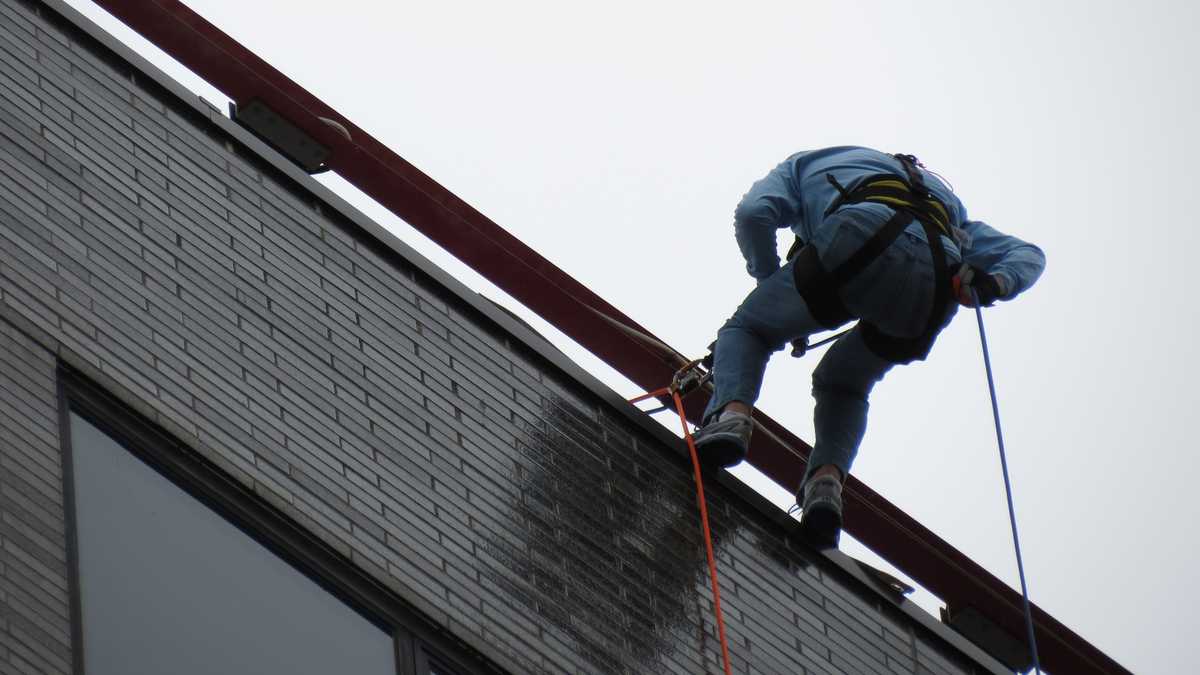 Images: Anthony and David rappel down Hub building