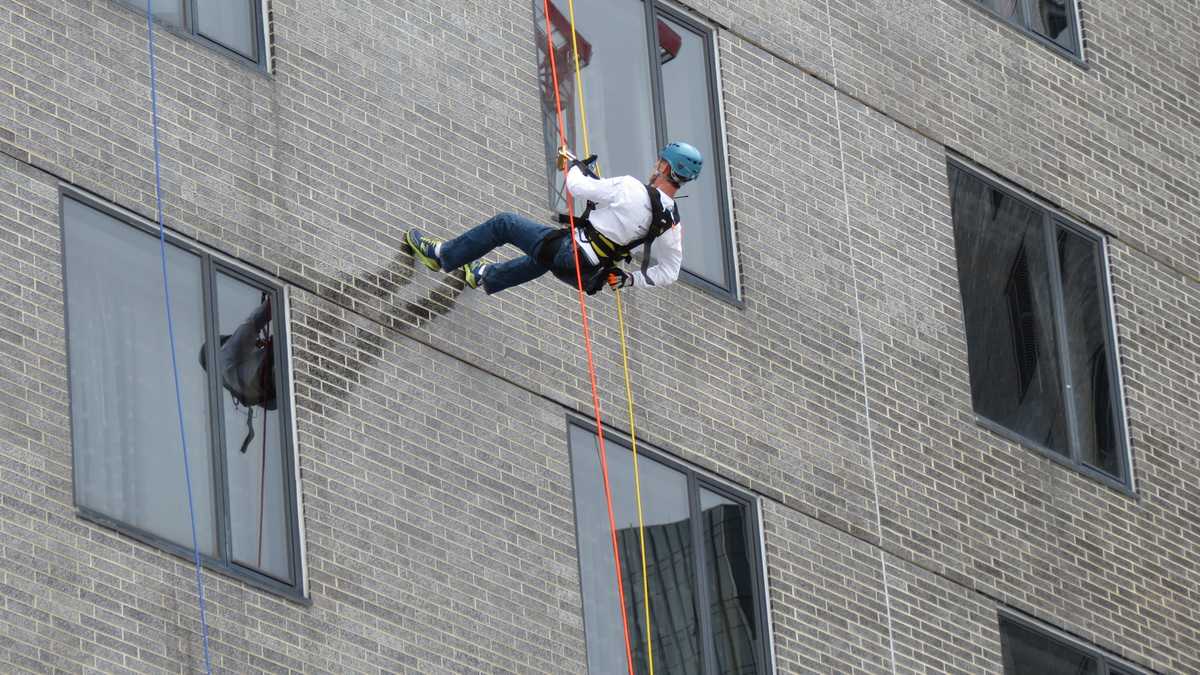 Images: Anthony and David rappel down Hub building