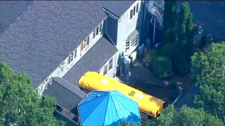 Photos: School bus rolls into building