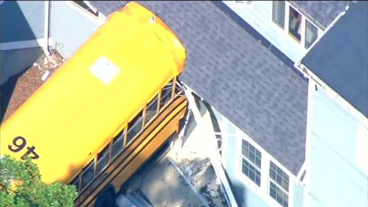 Photos: School bus rolls into building