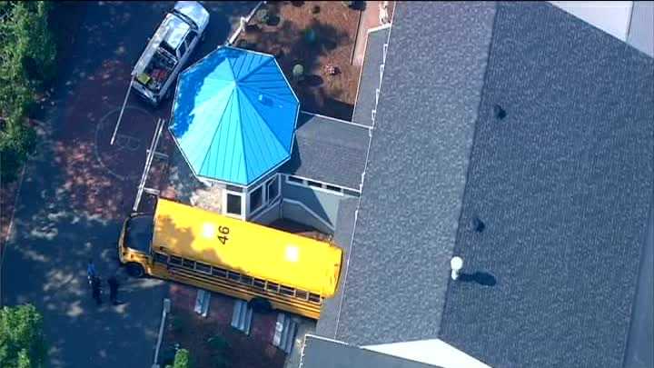 Photos: School bus rolls into building