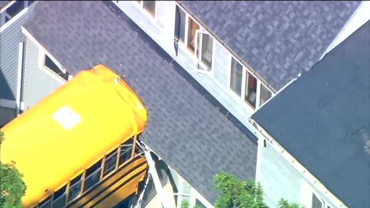Photos: School bus rolls into building