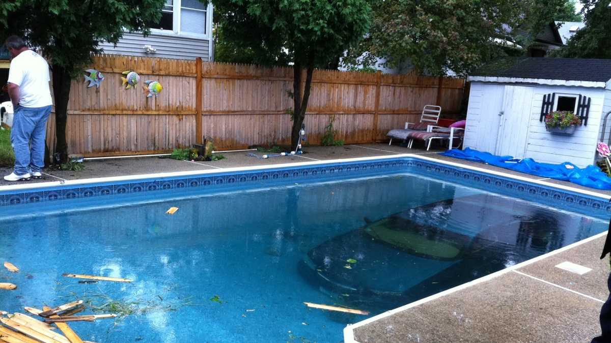 Vehicle crashes into backyard in-ground swimming pool