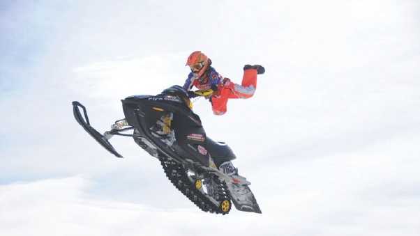 Montana Jess, doing his "Superman move" on his old Ski-doo at a race in Loudon, N.H. 