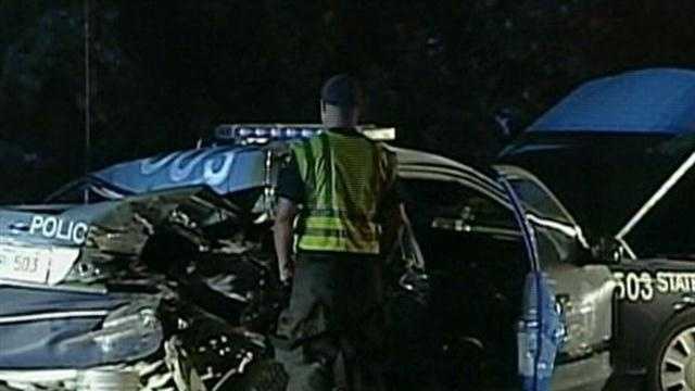 Trooper injured when truck slams into parked cruiser