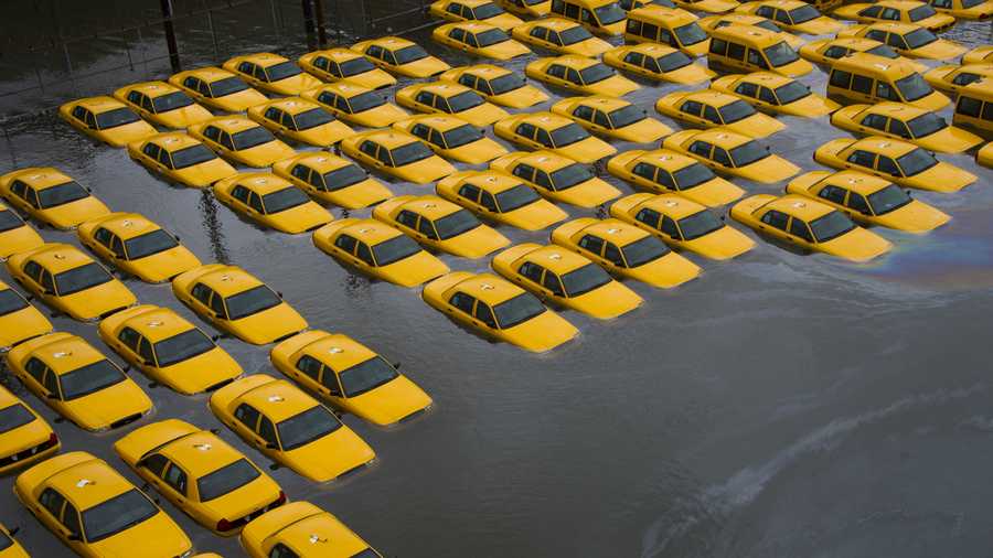A parking lot full of yellow cabs is flooded as a result of Hurricane Sandy on Tuesday, Oct. 30, 2012 in Hoboken, NJ. 