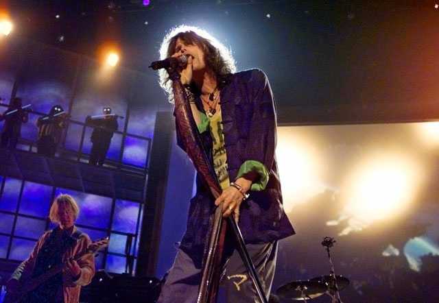 Aerosmith lead singer Steven Tyler sings 'God Bless America' during the  seventh inning stretch of the Red Sox home opener against the Detroit  Tigers at Fenway Park in Boston, Massachusetts on April