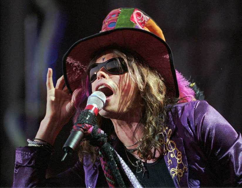 Aerosmith lead singer Steven Tyler sings 'God Bless America' during the  seventh inning stretch of the Red Sox home opener, 2008.…