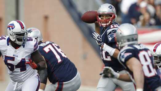 New England Patriots quarterback Tom Brady (12) throws during the first half of an NFL football game against the Buffalo Bills at Gillette Stadium in Foxborough, Mass., Sunday, Nov. 11, 2012.