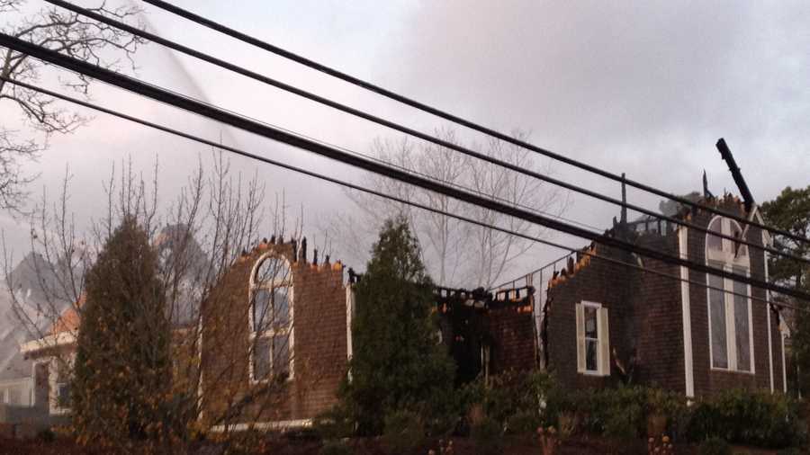 A three-alarm fire tore through the Cape Cod Bible Alliance Church in Brewster overnight.