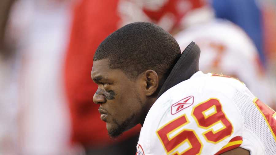 In this Dec. 11, 2011, file photo, Kansas City Chiefs' Jovan Belcher sits on the sidelines during the third quarter of the NFL football game against the New York Jets in East Rutherford, N.J. Police say Belcher fatally shot his girlfriend early Saturday, Dec. 1, 2012, in Kansas City, Mo., then drove to Arrowhead Stadium and committed suicide in front of his coach and general manager. 