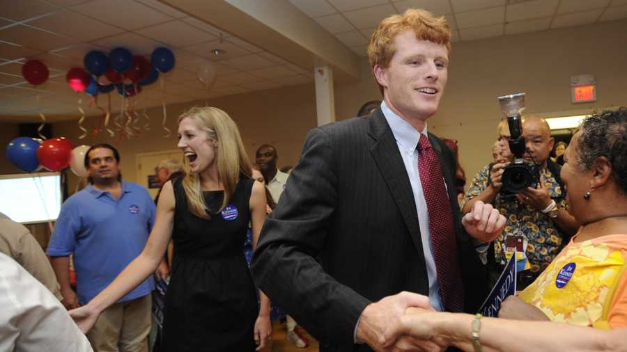 Joseph Kennedy III and his fiance Lauren Anne Birchfield, left, greet supporters during a party in Taunton, Mass., Thursday, Sept. 6, 2012.