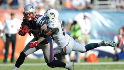 Tight end Aaron Hernandez (81) of the New England Patriots scores