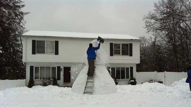 Todd Miller, of Westminster, has been building a snowman since the 2013 blizzard, adding to it every storm.