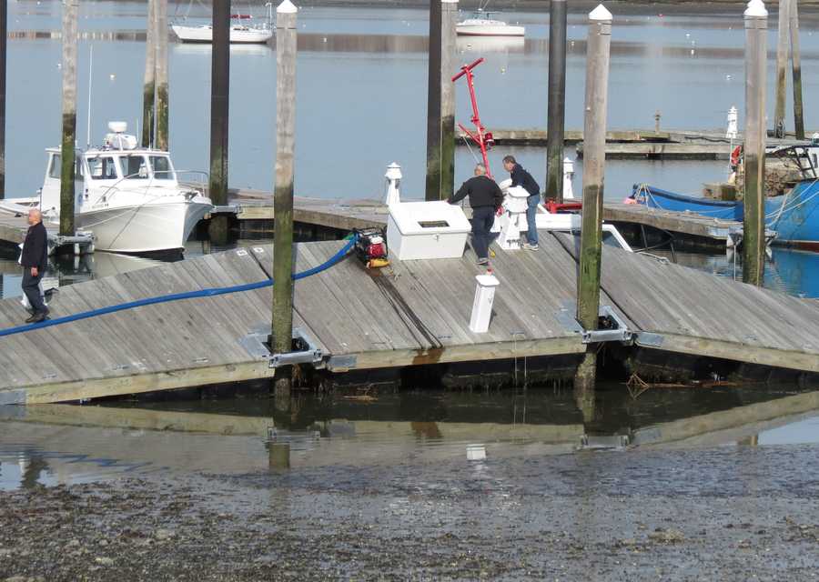 Images Winthrop fire boat takes on water, tips under pier