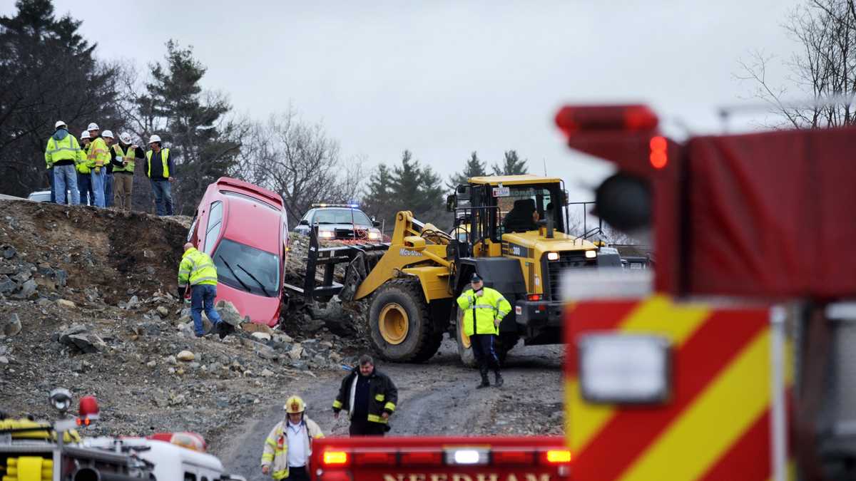 Images Car crashes over embankment at construction site