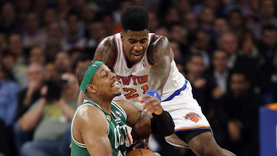 New York Knicks forward Iman Shumpert (21) and Boston Celtics forward Paul Pierce (34) fight for the ball in the first half of Game 5 of their first-round NBA basketball playoff series at Madison Square Garden in New York, May 1, 2013