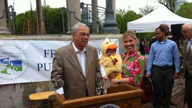 Boston Mayor Tom Menino greets families at the end of the parade route.
