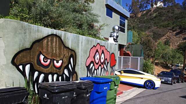 This Sunday, May 12,2013 photo shows a mural painted on the outside of Grammy-winning musician Chris Brown's Hollywood Hills home. Neighbors are unhappy with what some are calling frightening art he's chosen to have painted along the curb.