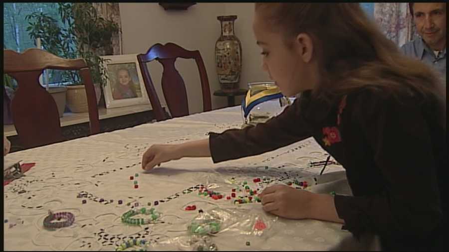 Girl makes bracelets to support Boston One Fund