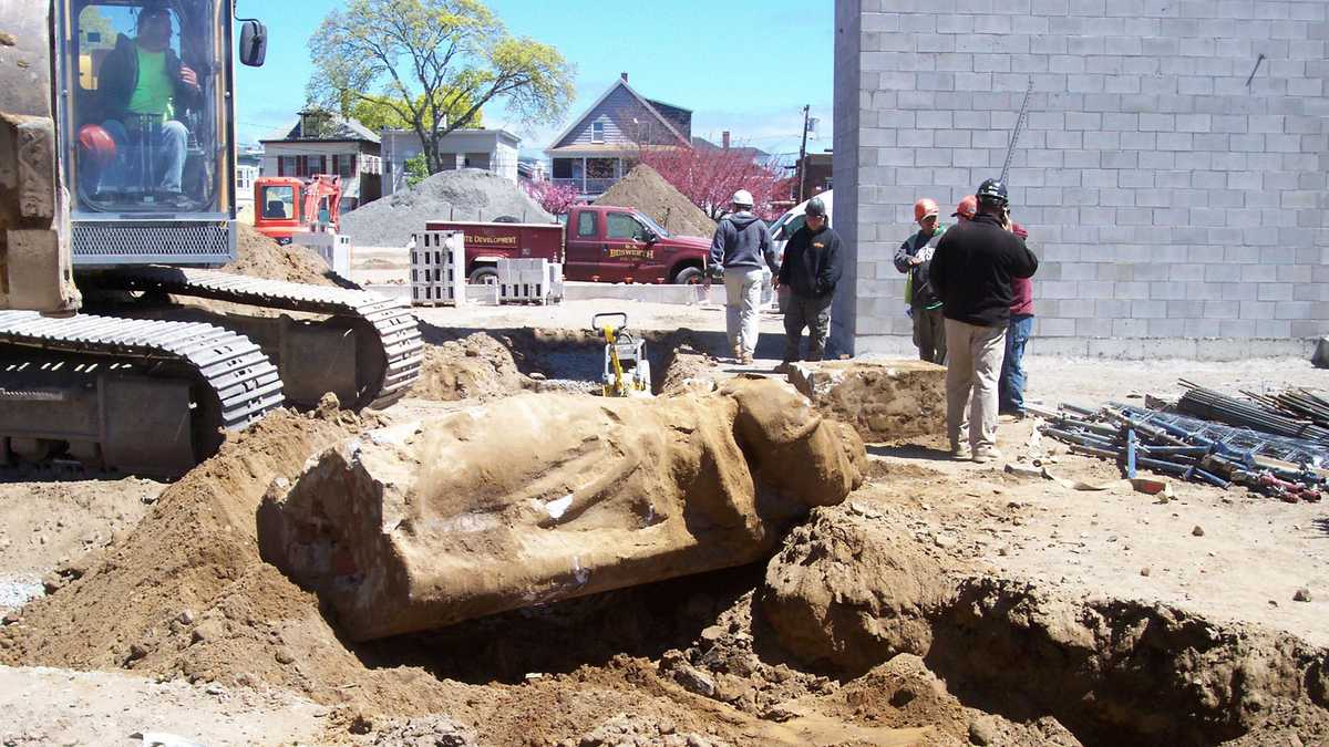 Workers find decades old statue buried underground