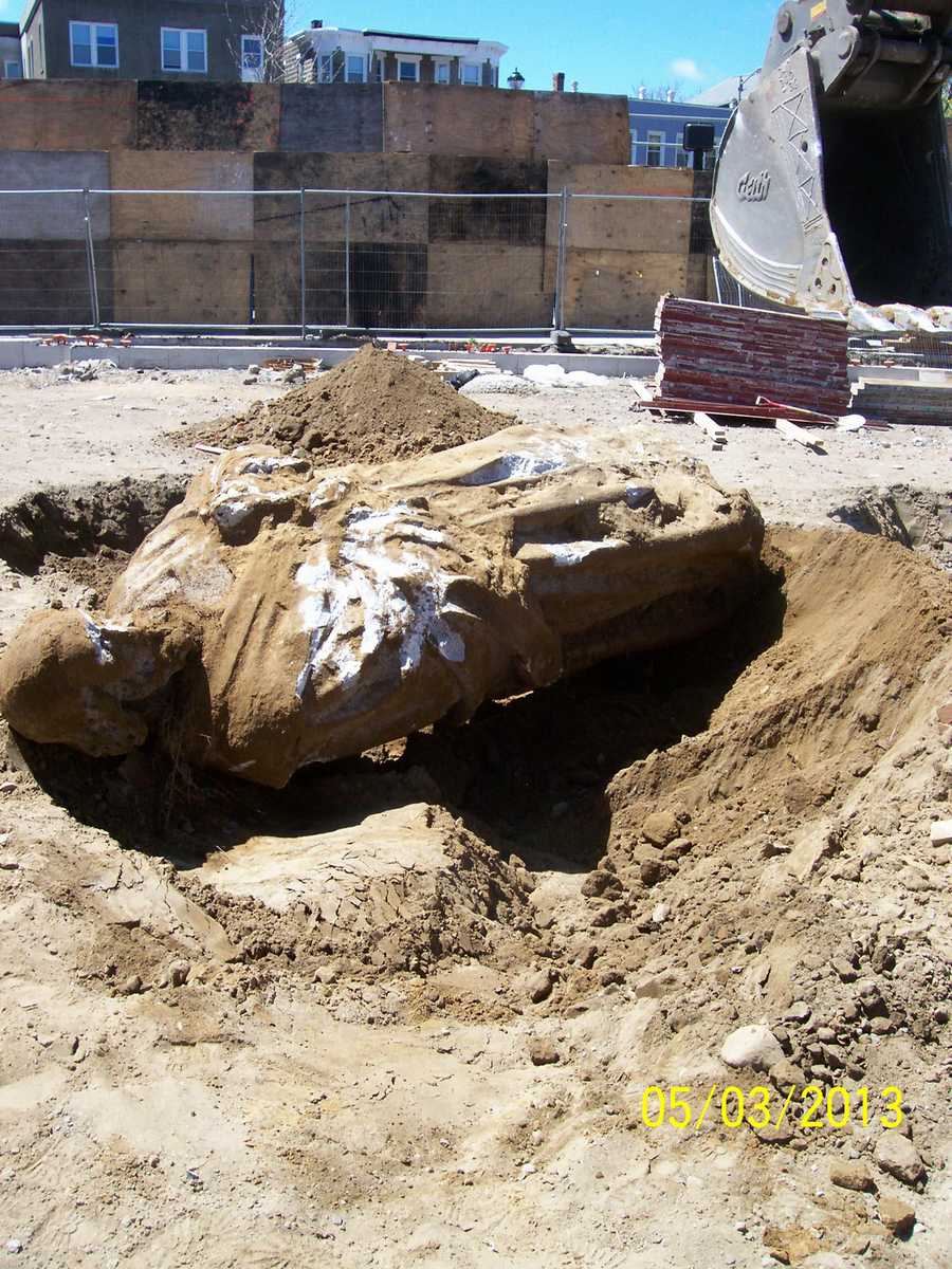 Workers find decades old statue buried underground