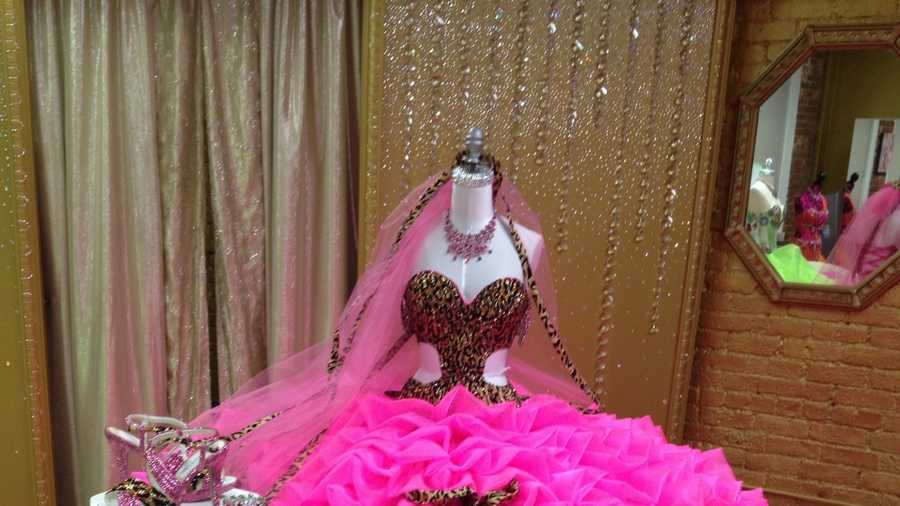 When asked to custom design a wedding dress for “Hellie” Mellie Stanley, Sondra Celli, “America’s No.1 Gypsy Designer” combined a wild leopard print with a “screaming” hot pink satin organza.