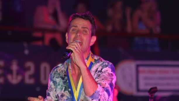 Joe McIntyre singing "5 Brothers and a Million Sisters" while wearing his Boston Marathon medal on the fifth annual NKOTB cruise to the Bahamas, May 21, 2013.