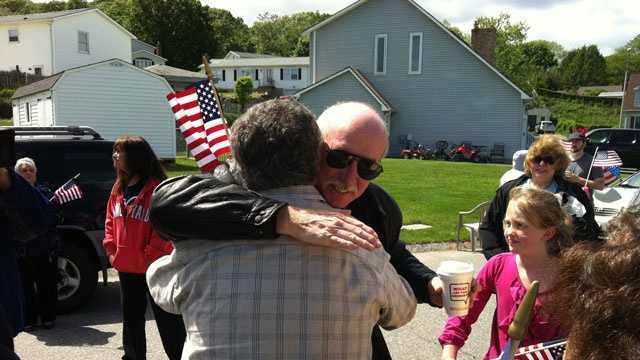 Watertown Police Sgt. Jeff Pugliese is surprised with a party for his acts of heroism on May 26, 2013.