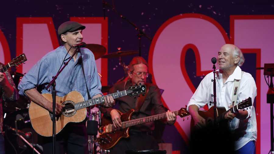James Taylor, left, and Jimmy Buffett perform at the Boston Strong Concert: An Evening of Support and Celebration at the TD Garden.