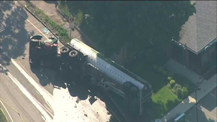Photos: Tanker crashes, leaks fuel in neighborhood