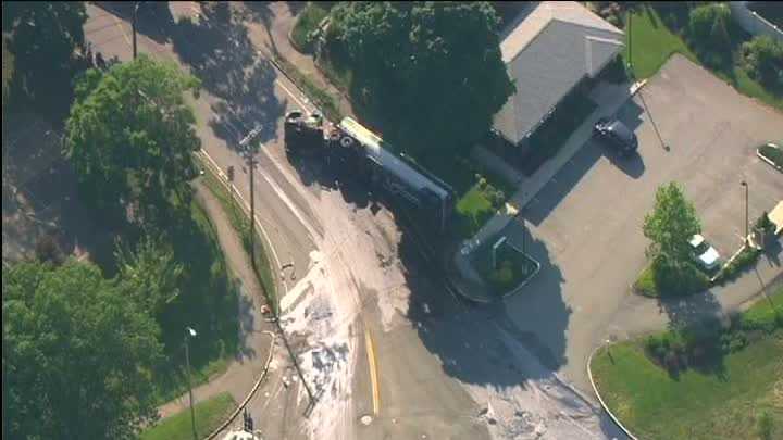 Photos: Tanker crashes, leaks fuel in neighborhood