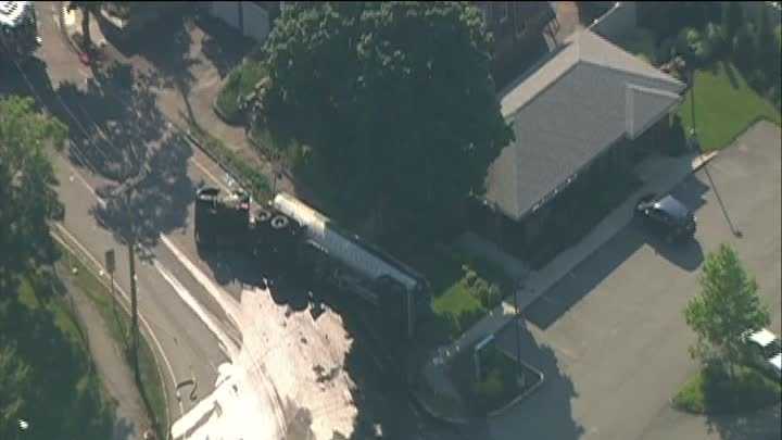 Photos: Tanker crashes, leaks fuel in neighborhood