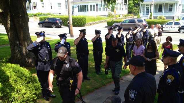 Plymouth Police officers salute K9 dog Kaiser before he was euthanized on Friday, May 31, 2013.