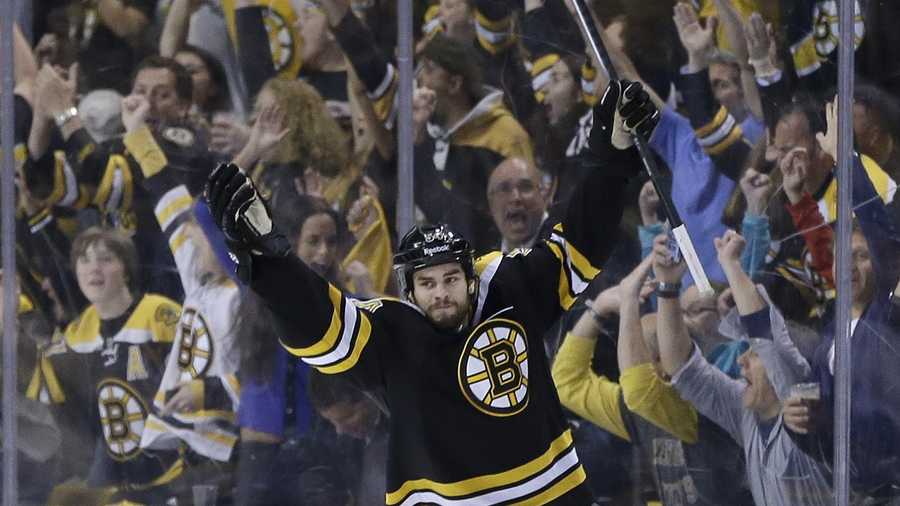 Boston Bruins defenseman Adam McQuaid  celebrates his goal against the Pittsburgh Penguins during the third period of Game 4 in the Eastern Conference finals of the NHL hockey Stanley Cup playoffs, in Boston on Friday, June 7, 2013. 