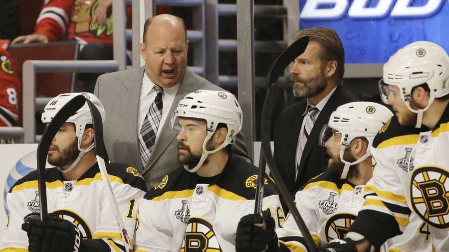 Boston Bruins head coach Claude Julien talks to his team during the first period of Game 1 in their NHL Stanley Cup Final hockey series against the Chicago Blackhawks, Wednesday, June 12, 2013, in Chicago.