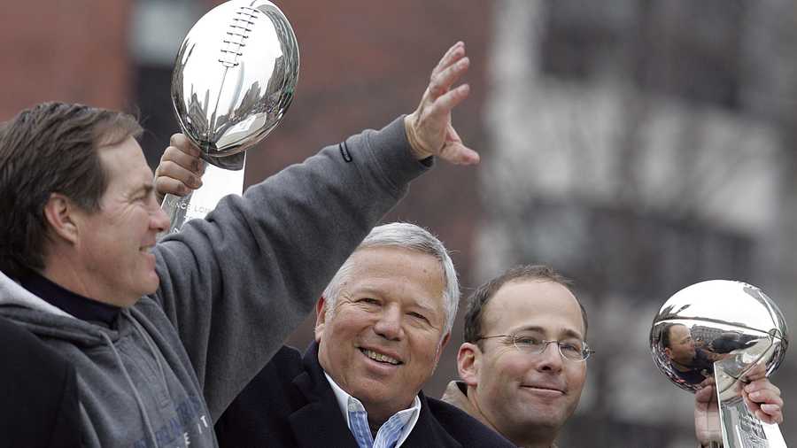 From left, New England Patriots head coach Bill Belichick, owner Robert Kraft and vice chairman Jonathan Kraft ride in the Super Bowl victory parade in Boston, Tuesday, Feb. 8, 2005. The Patriots beat the Philadelphia Eagles 24-21 in Super Bowl XXXIX on Sunday Feb. 6.