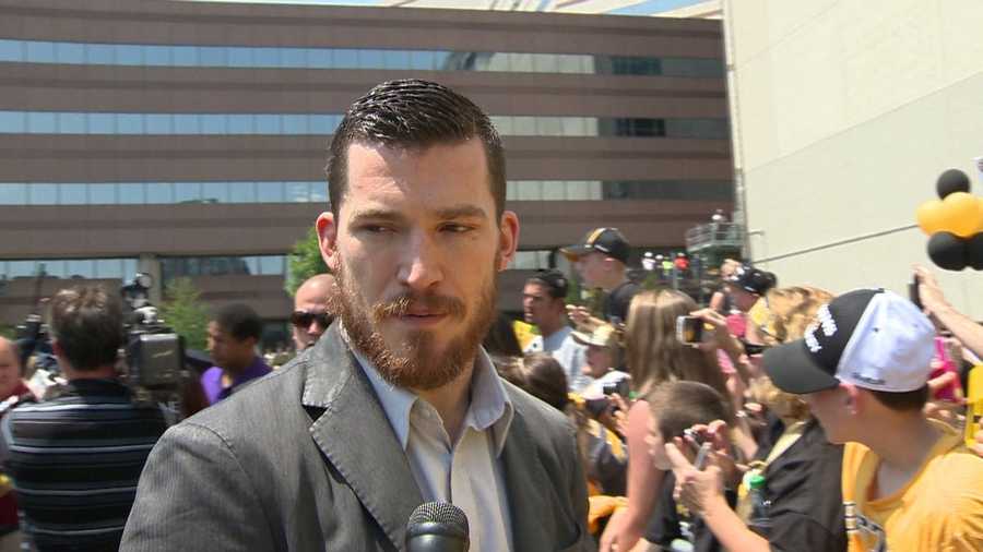 Andrew Ference speaks with members of the media. 