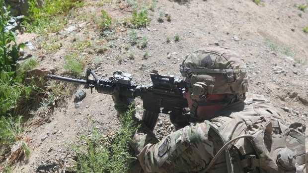U.S. Army Sgt. Corey Garver, with Baker Company, 1st Battalion, 506th Infantry Regiment, 4th Brigade Combat Team, 101st Airborne Division, provides security as Soldiers with Baker Company and Afghan National Army soldiers clear a village in Paktia province, Afghanistan, May 29, 2013