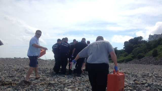 Emergency crews tend to the victim on Winthrop Beach