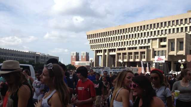 Concert goers leave the 103.3 AMP Radio Bash on City Hall Plaza in Boston.