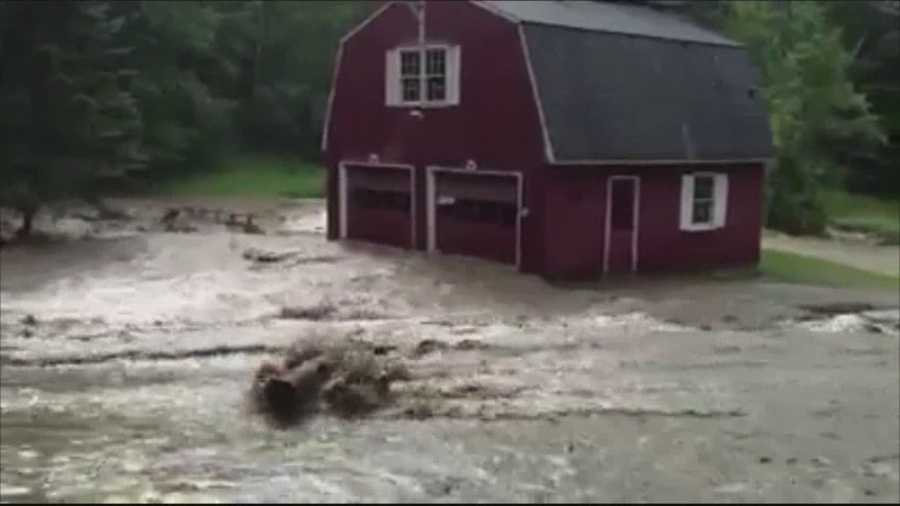 Flash floods in the Upper Valley forced firefighters to evacuate people from their homes Tuesday, carefully guiding them over a road covered with rocks and gushing water.
